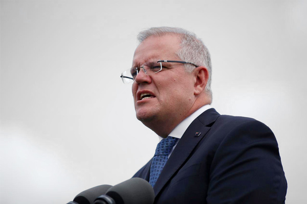 Get off the grass: Australian PM was interrupted by a local resident while he was announcing stimulu Get off the grass: Australian PM was interrupted by a local resident while he was announcing stimulu