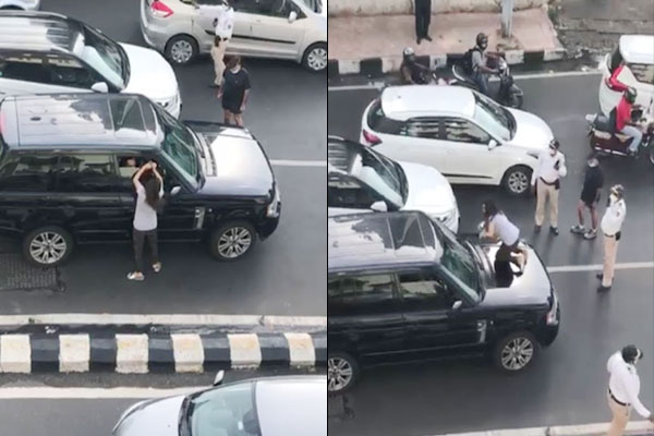 Woman chases husband car stands in front of his car to block traffic Woman chases husband car stands in front of his car to block traffic